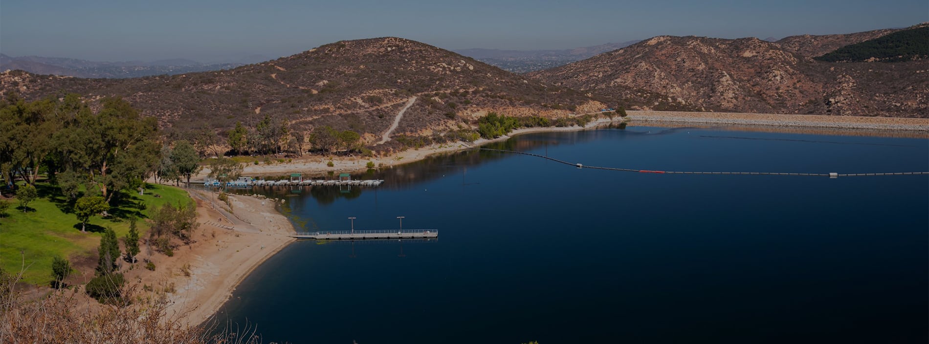 Panoramic view of Lake Poway. Discover homes for sale opportunities with the best real estate agents in San Diego.
