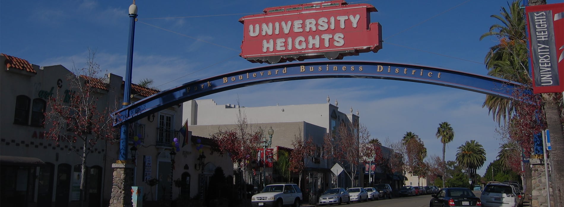 View of University Heights Street Sign. Discover homes for sale opportunities with the best real estate agents in San Diego.