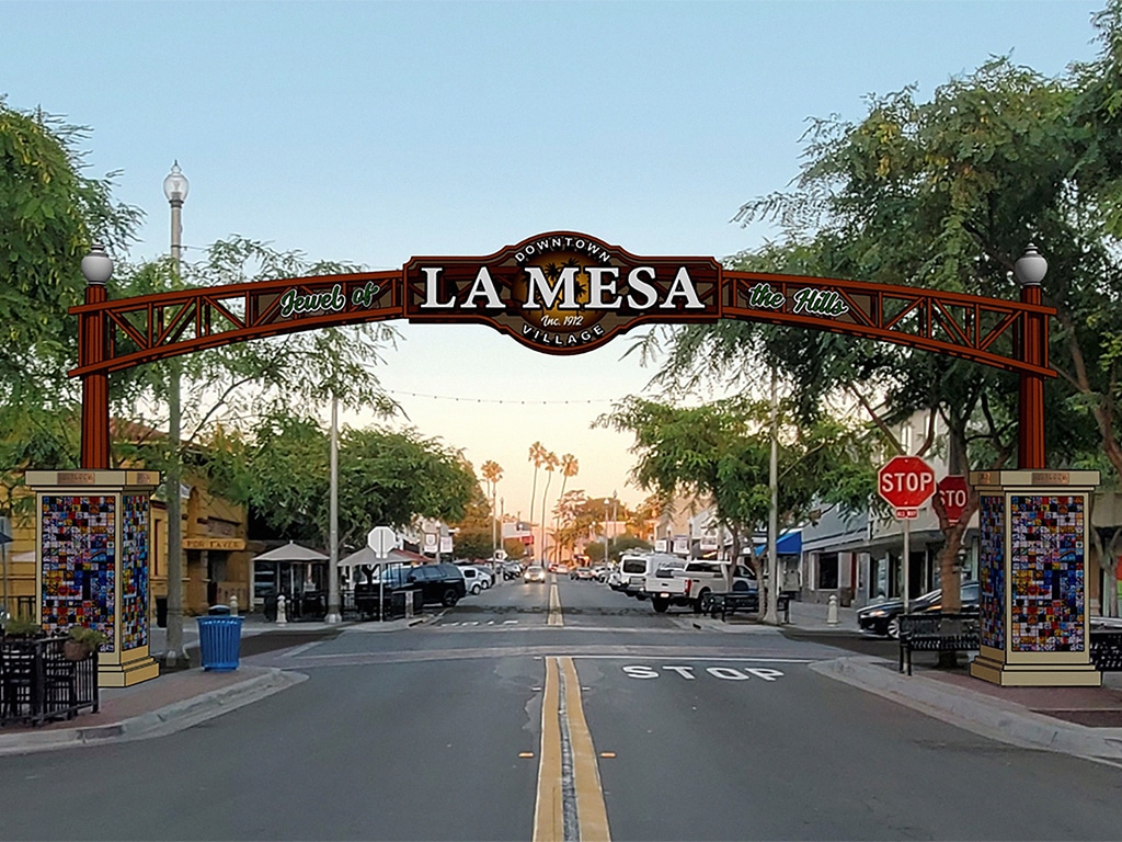 La Mesa, San Diego: A vibrant cityscape with palm trees, buildings, and a clear blue sky in the background.