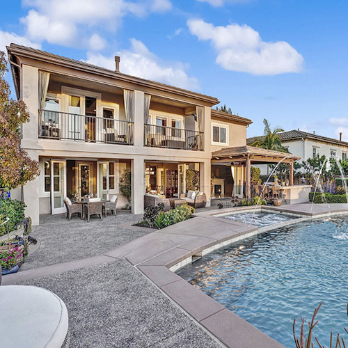 A spacious home in Arrowood Community, Oceanside, CA, featuring a pool and patio for outdoor relaxation and entertainment.