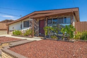 Just Leased! A cozy home showcasing a distinctive red rock in Serra Mesa, San Diego. Leased for $3,895/month by Palm Tree Properties.
