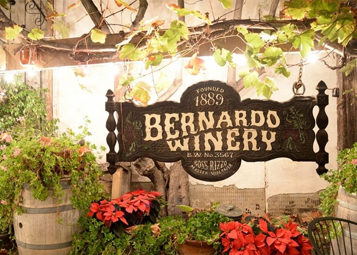 View of Bernardo Winery entrance sign. Discover homes for sale opportunities with the best real estate agents in San Diego.