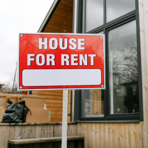 Eye-catching "MARKETING YOUR PROPERTY" house for rent sign.