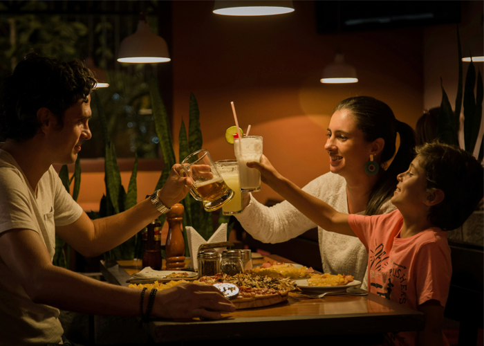 A happy couple sitting on the table, demonstrating positive tenant-landlord relationship with property management agent